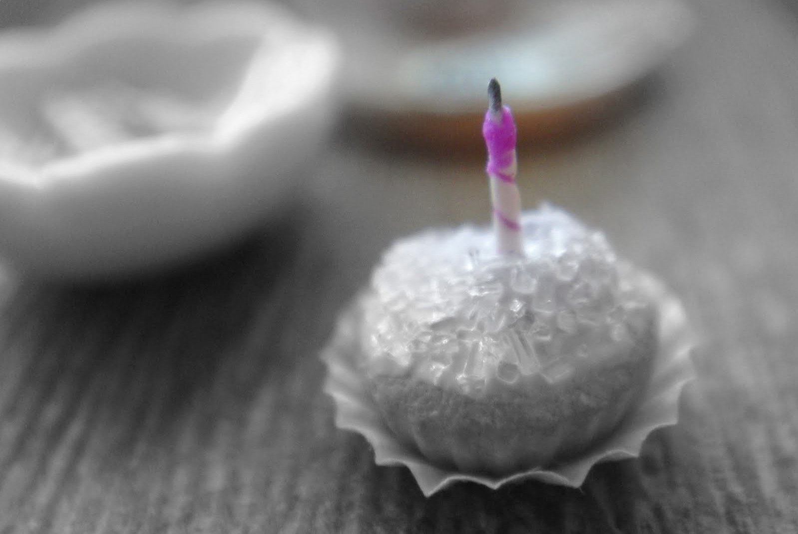 miniature purple candle on cupcake